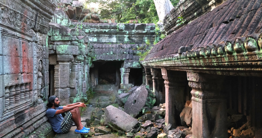 a man sitting in temple ruins